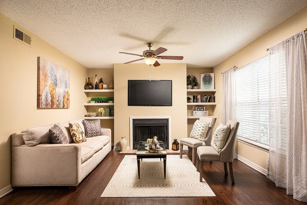 a living room with a ceiling fan and a television at Madison Oaks Apartment Homes, LLC, Palm Harbor, 34684