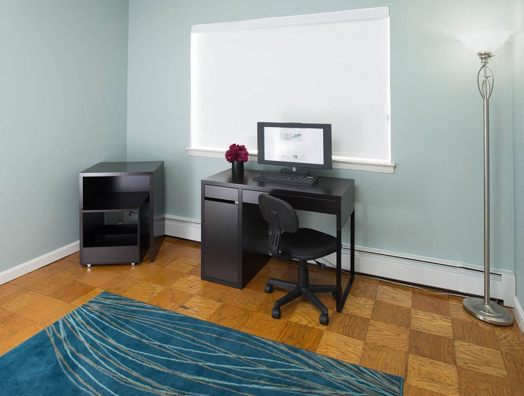 a home office with a desk and a computer at Raritan Crossing Apartment Homes, New Brunswick