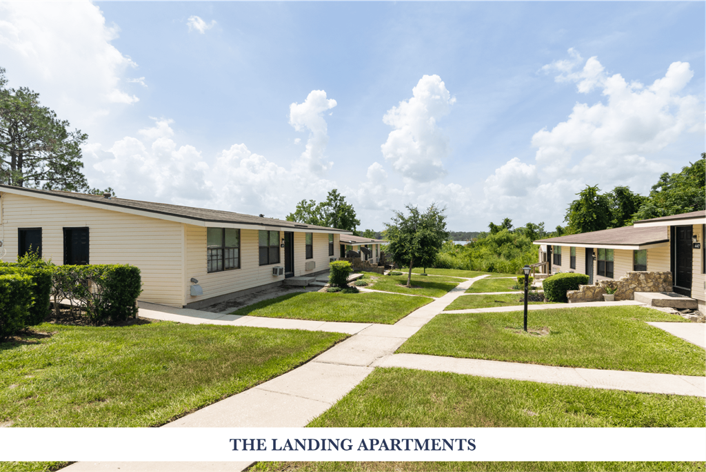 Apartment complex with a sign that says "The Landing Apartments".