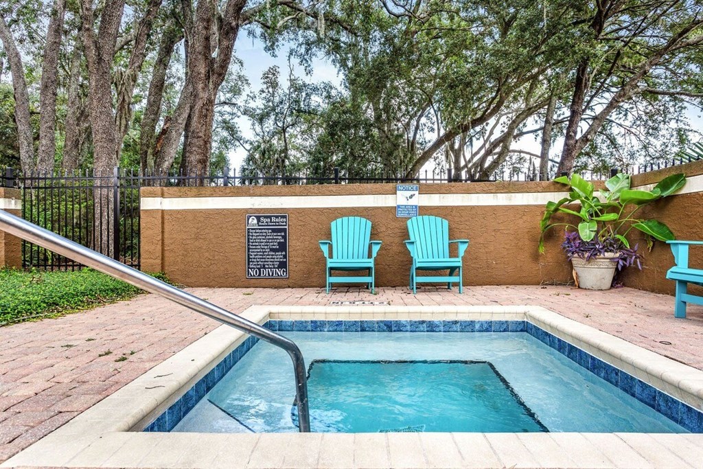 A pool with a no diving sign on the wall.