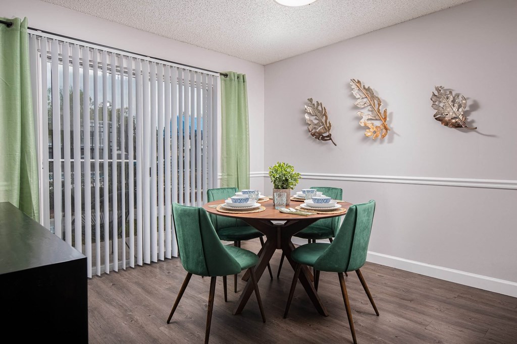 our apartments offer a dining room with a table and chairs  at The Park at Chesterfield Apartment Homes, Tampa, Florida