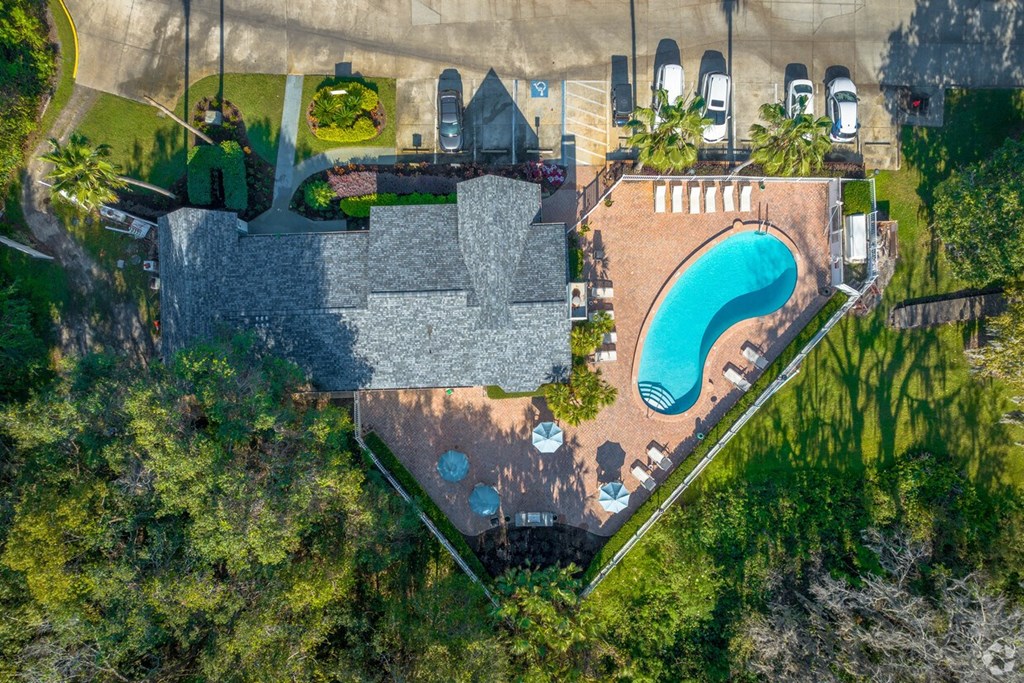 A large house with a pool in the backyard.