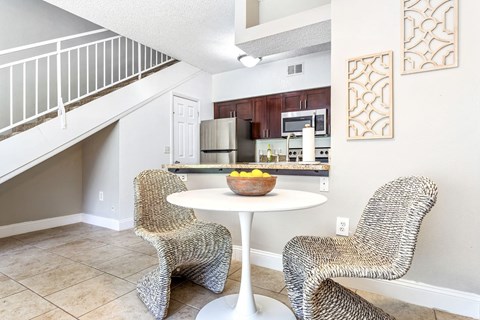 a living room with two chairs and a table