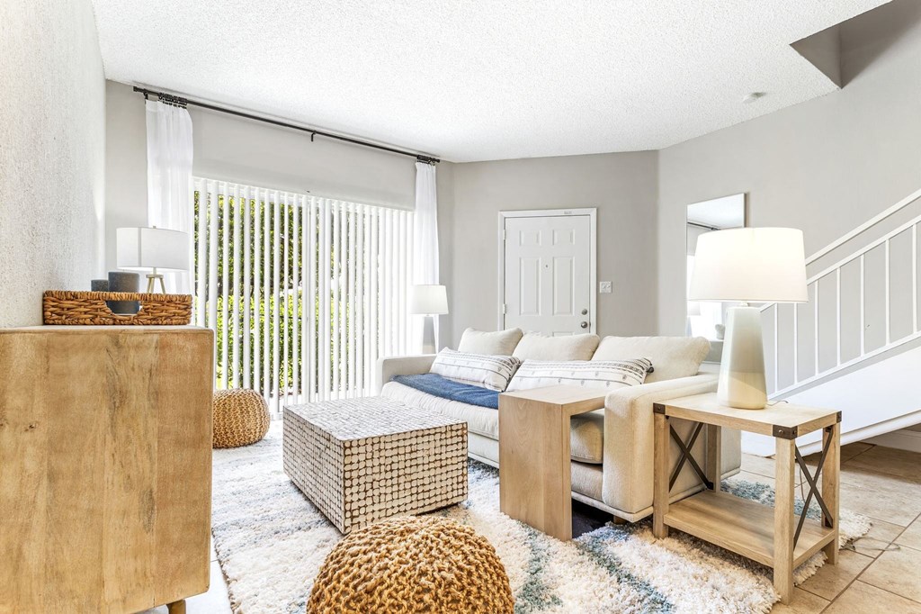 a living room with a couch and a table at Waterford Park Apartment Homes, LLC, Lauderhill Florida