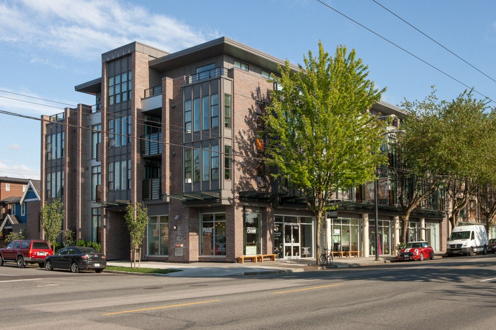a brick building with a tree in front of it