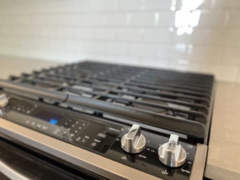 a close up of a stove top oven in a kitchen