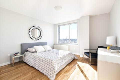 Bedroom with a Bed at The Icon 52 Apartments, Woodside, NY