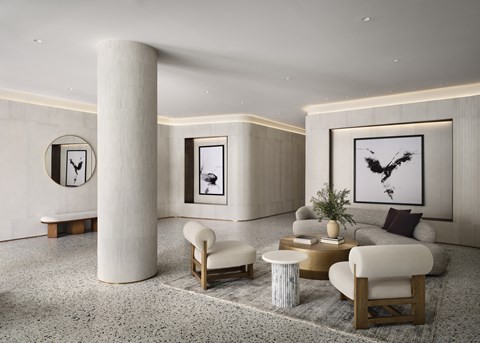 A modern living room with a large abstract painting on the wall.