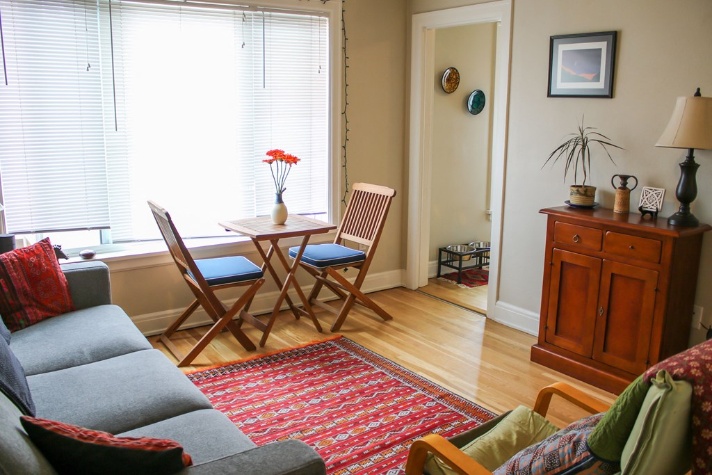 a living room with a table and chairs and a couch