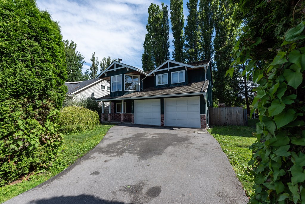 a house with a large driveway in front of it