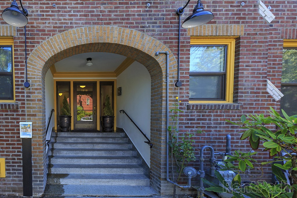a brick building with an arched doorway