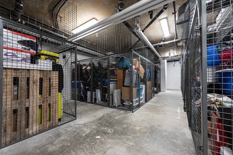 A storage room with a lot of items and a concrete floor.