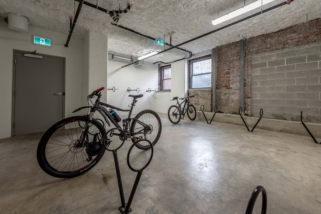 a room with bikes on display in a garage