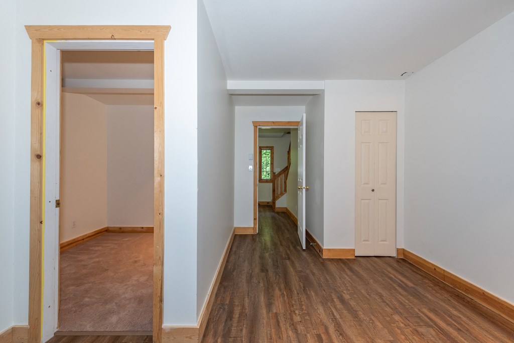 a view from the living room through the dining room to the hallway