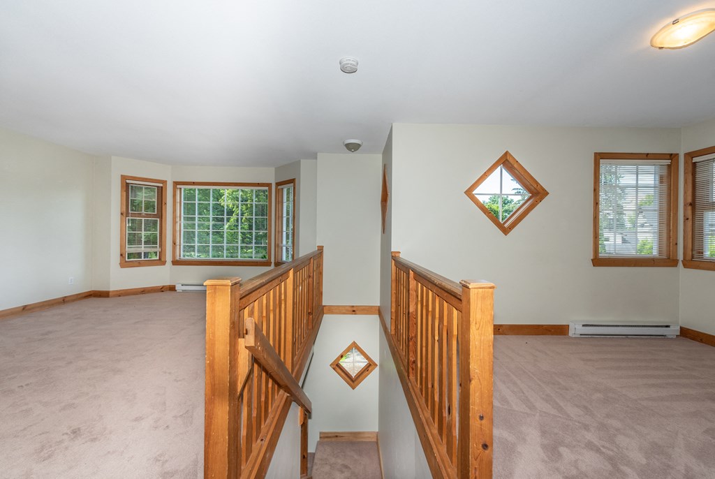 a bedroom with a staircase in a house