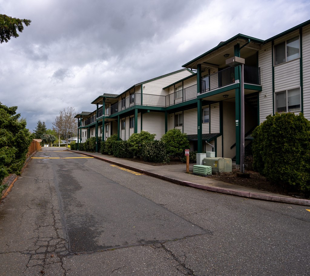 a row of apartment buildings on a cloudy day