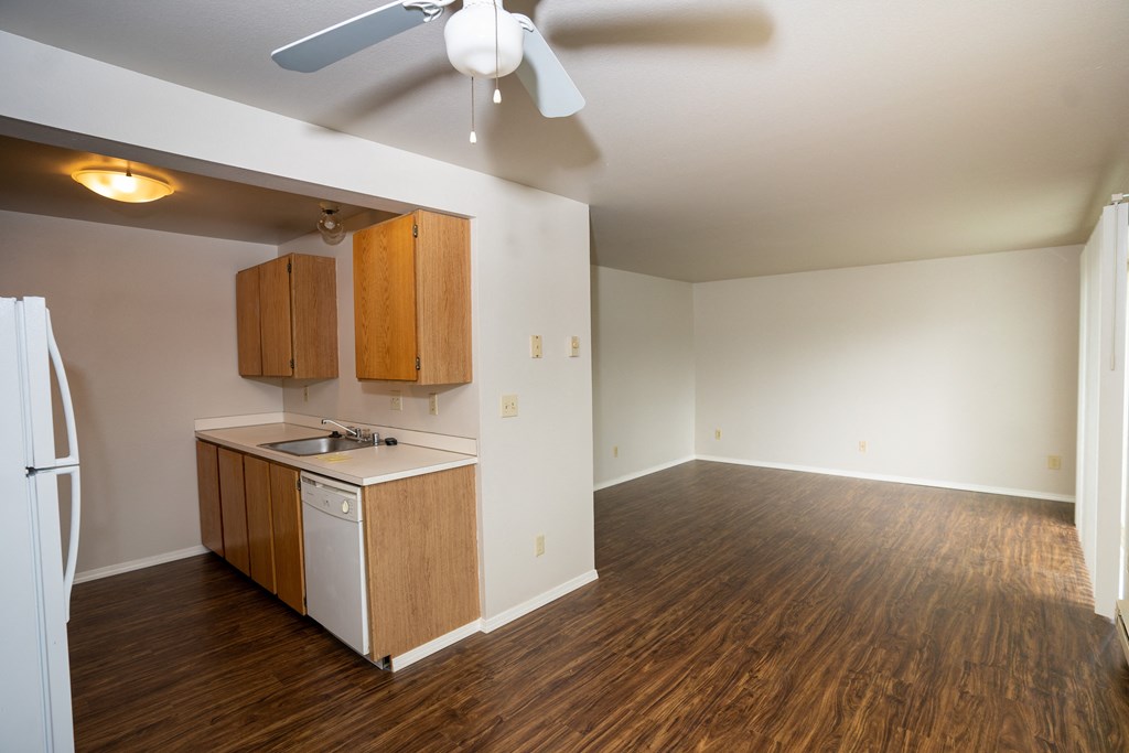 a kitchen and living room in a 555 waverly unit