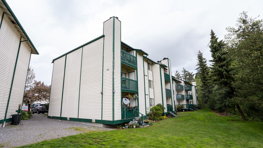 a view of the apartments from the parking lot