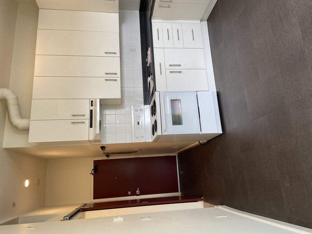 a view of the kitchen from the dining room