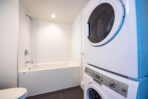 a bathroom with a washer and dryer