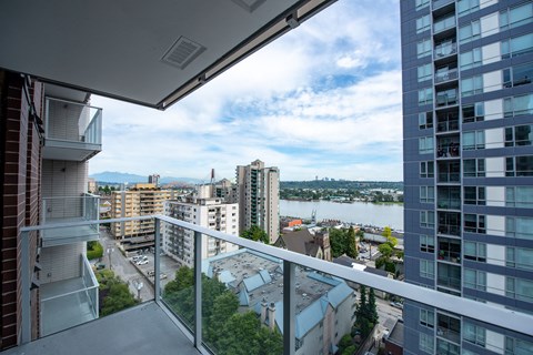 a balcony with a view of the city