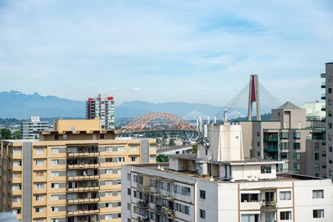 a view of the tacoma narrows bridge from an apartment building in tacoma