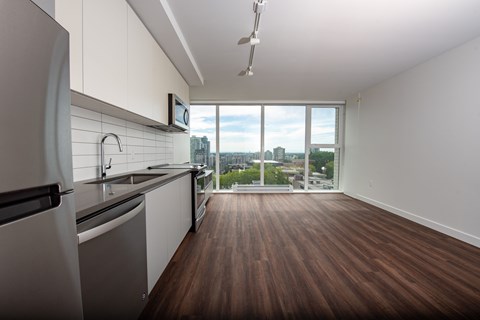 A modern kitchen with a view of the city.