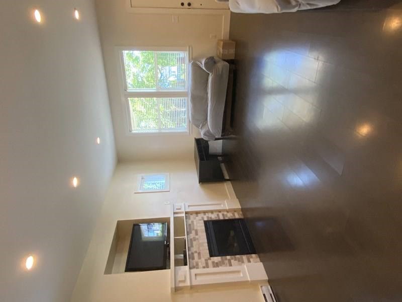A bathroom with a window and a sink.