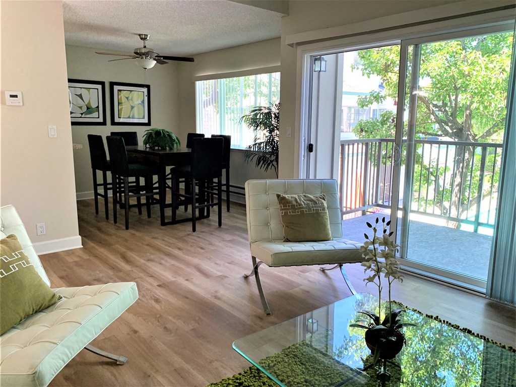 2 bedroom model dining room with window, 6 seater dining table . this model has hardwood flooring