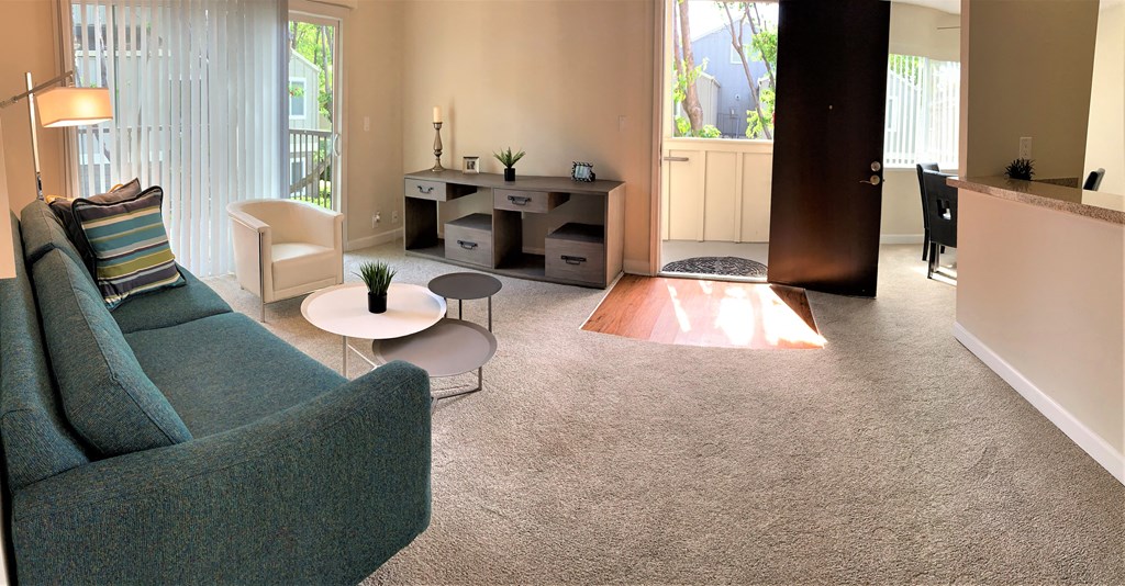 one bedroom living room with furniture/ TV stand. Front door