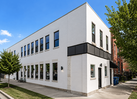 A white building with black trim and windows.