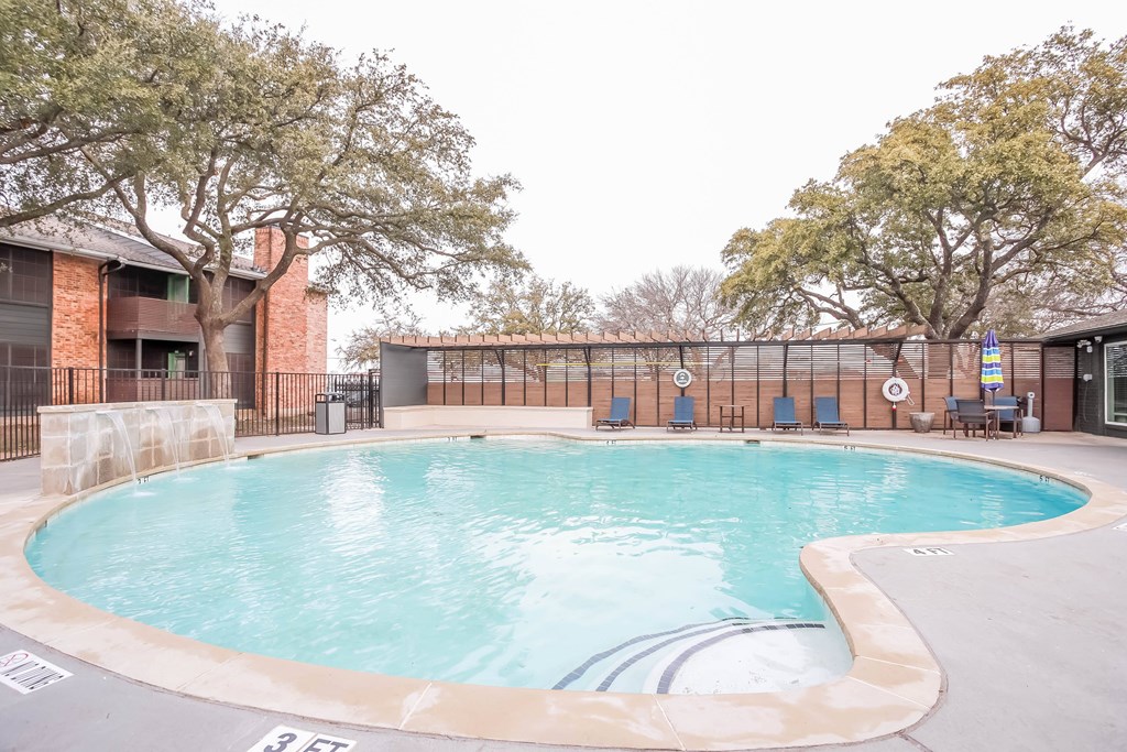 A small pool surrounded by a 3 feet deep sign.