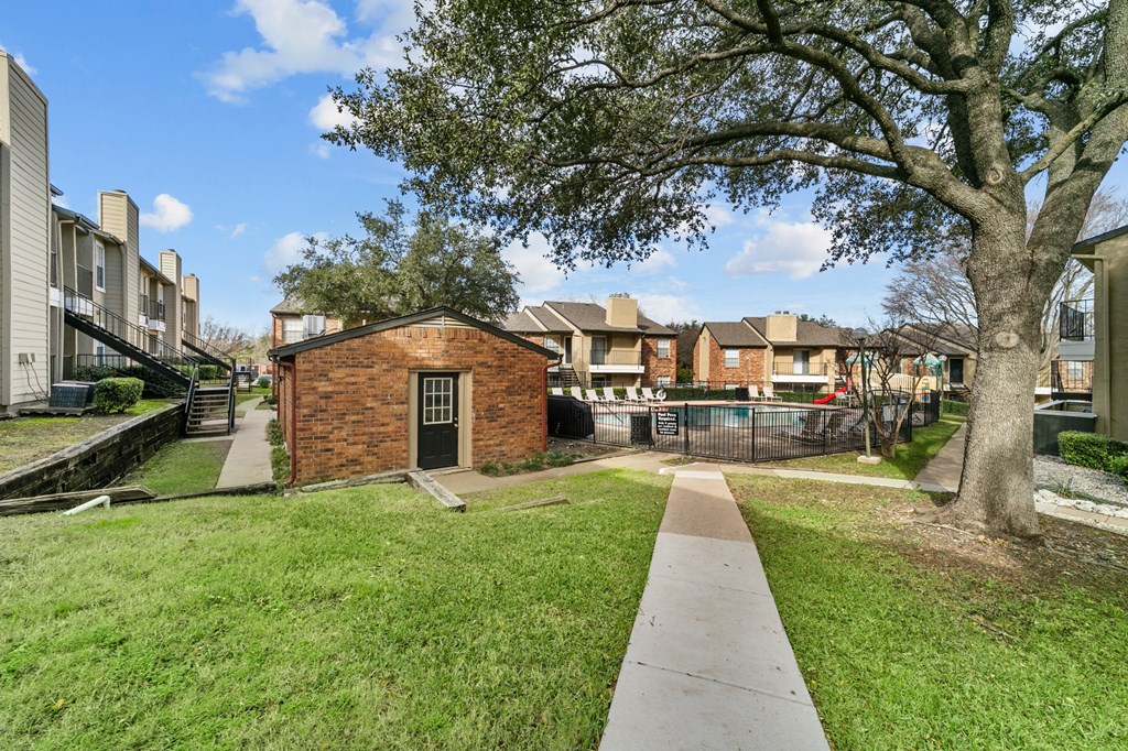 the preserve at ballantyne commons apartments walkway and yard with pool and trees