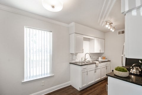 the preserve at ballantyne commons apartment kitchen with white cabinets