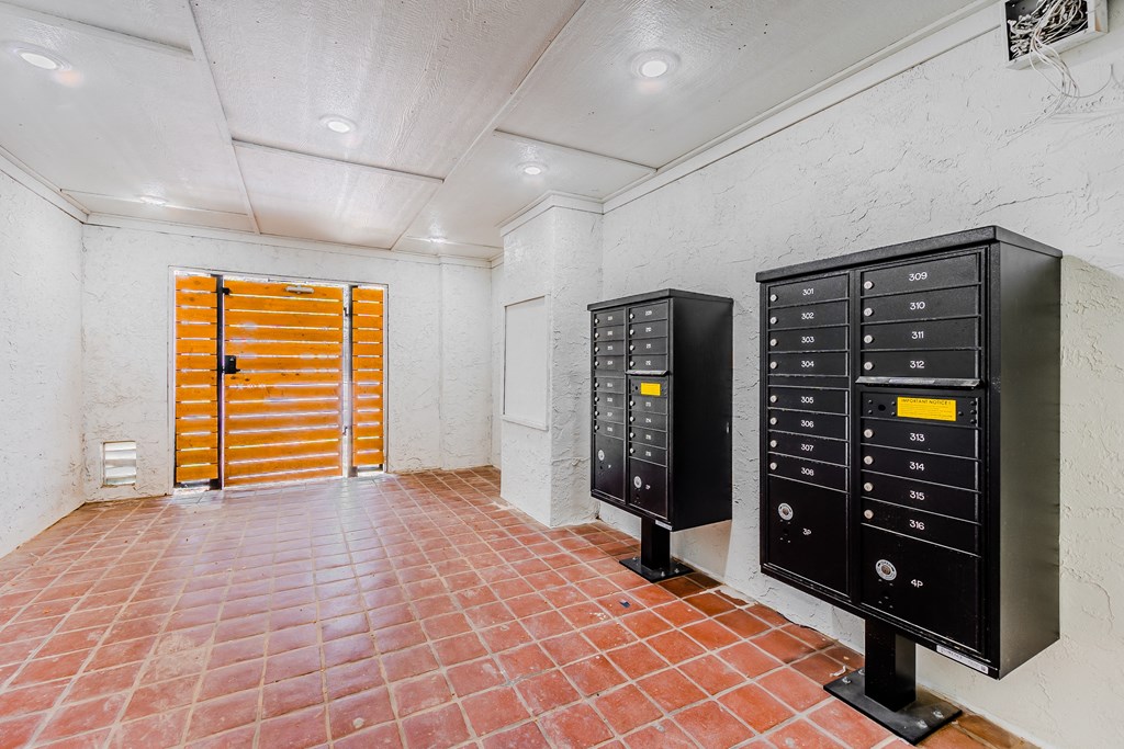 a room with three filing cabinets and a yellow door