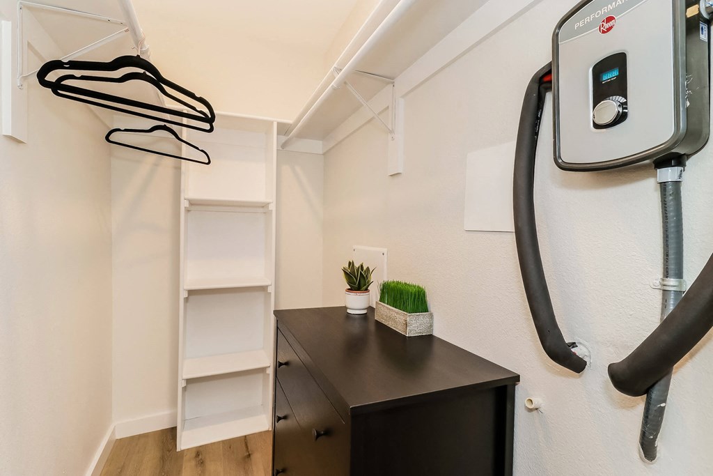 a workout room with a treadmill and a desk at The Eastern Apartments, Dallas, TX