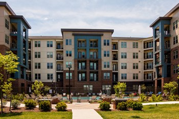 Residential building with private balconies surrounding the pool deck at Liberty Mill in Germantown, MD - Photo Gallery 15