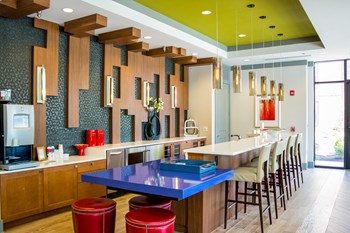Resident clubhouse communal kitchen and bar with coffee station at Liberty Mill in Germantown, MD - Photo Gallery 4