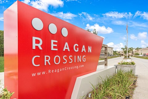 Front entrance sign at Reagan Crossing in Covington, LA