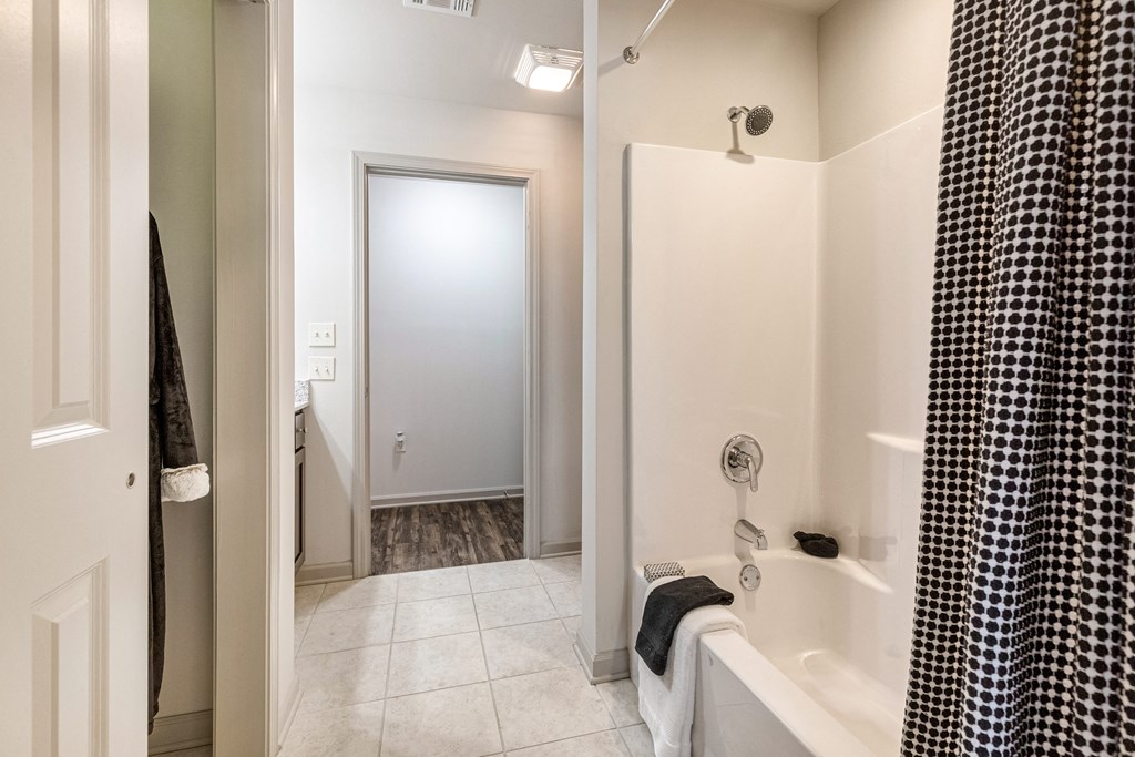 Bathroom with a tub/shower and tile flooring at Reagan Crossing in Covington, LA
