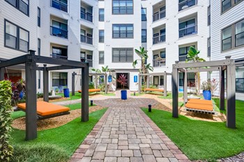 Outdoor lounge area with oversized hammock beds at EOS in Orlando, FL - Photo Gallery 5