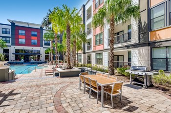 Poolside grilling station and al fresco dining area at EOS in Orlando, FL - Photo Gallery 3