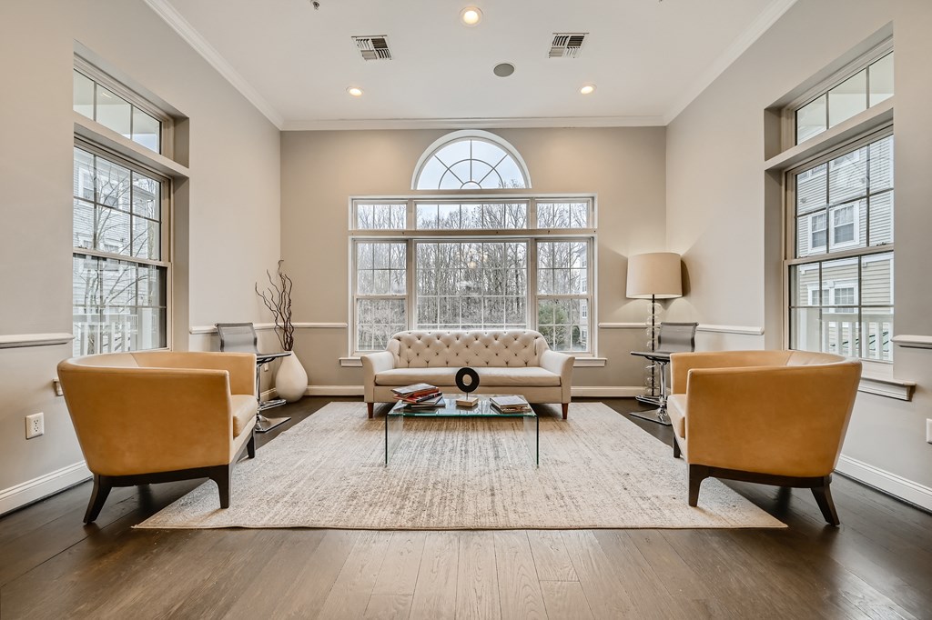 Leasing office seating area with sofas and chairs at Park at Kingsview Village in Germantown, MD