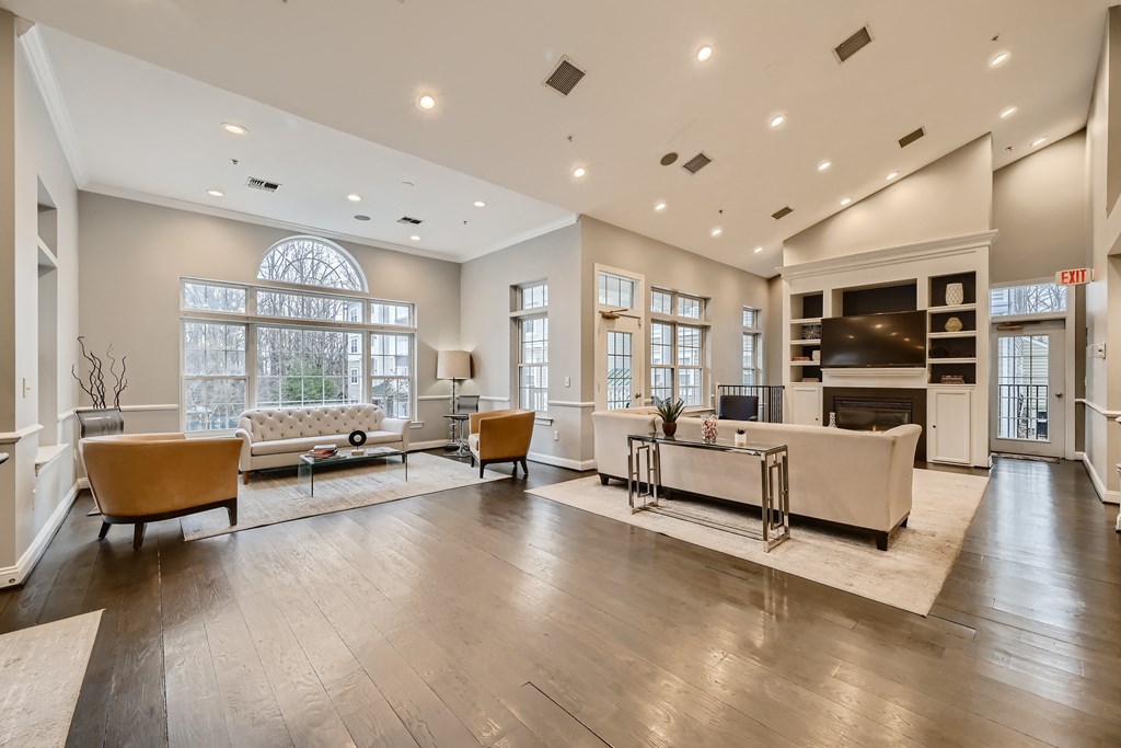 Interior of the leasing office and clubhouse with various seating areas at Park at Kingsview Village in Germantown, MD