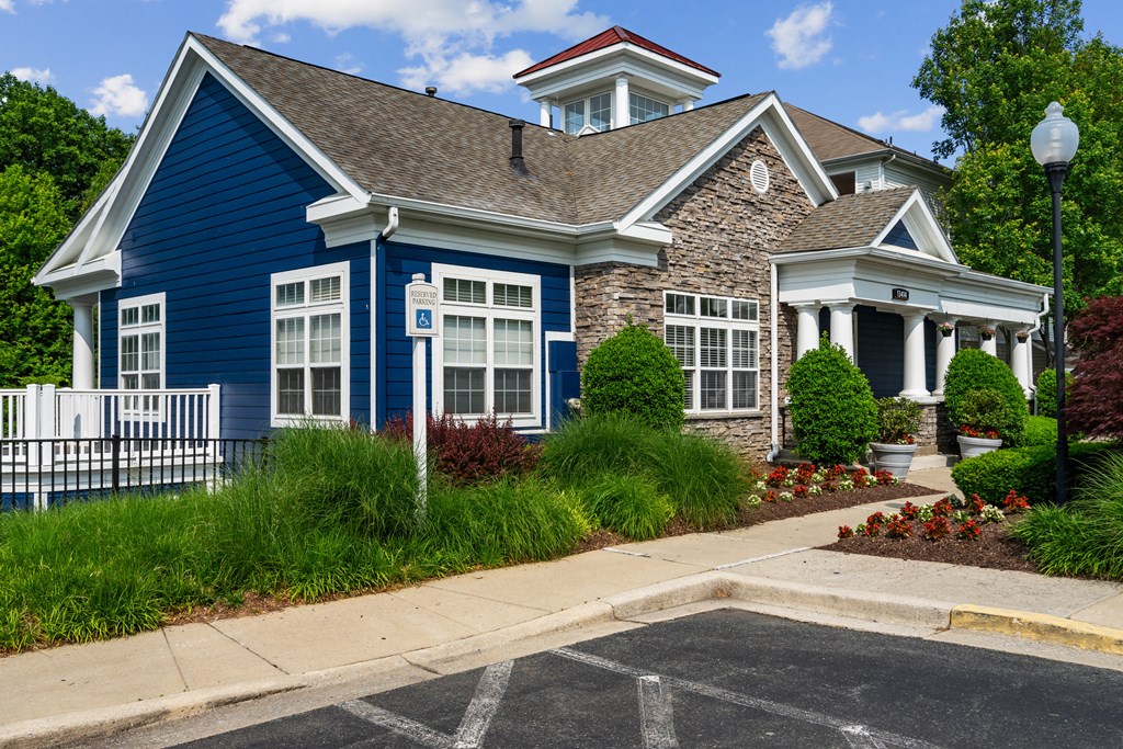 a blue house with a gray roof