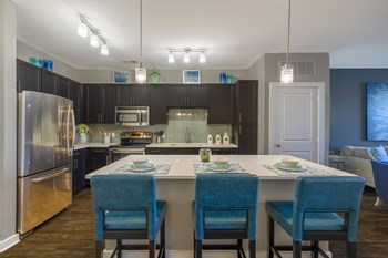 Kitchen with granite countertops, shaker-style cabinetry, and stainless steel appliances at Liberty Mill in Germantown, MD - Photo Gallery 24