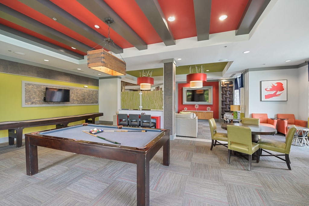 community room with a pool table and a flat screen tv