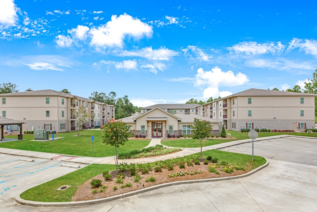 Overlooking the property at Reagan Crossing in Covington, LA with leasing office and residential buildings
