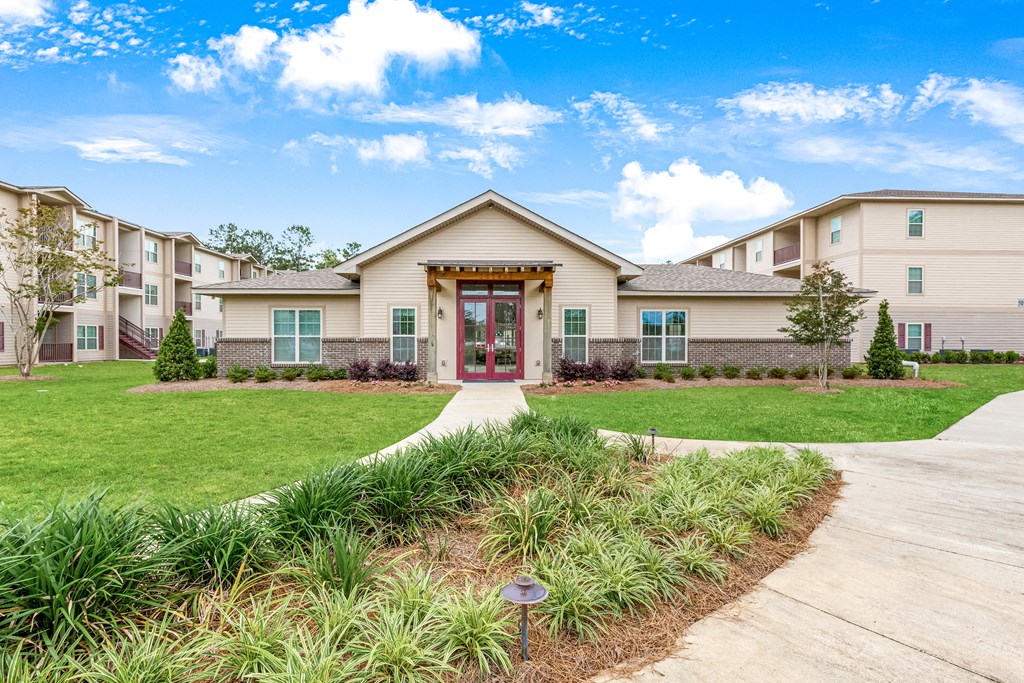 Lush landscaping in front of the leasing office at Reagan Crossing in Covington, LA