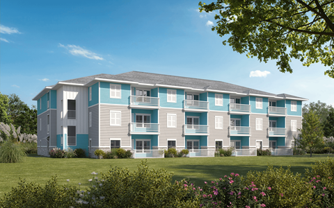 A large apartment building with balconies and multiple windows. at Allegra at Cocoa in Cocoa, FL, 32926